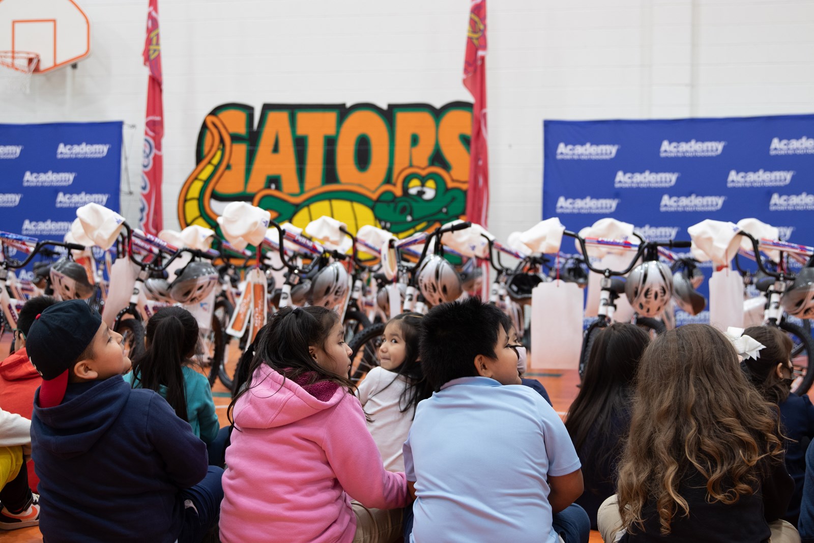 Season of Giving Continues: Academy Sports Gives 100 Bikes to Green Acres  Students, Omni Hotels Surprises a Teacher, Principal