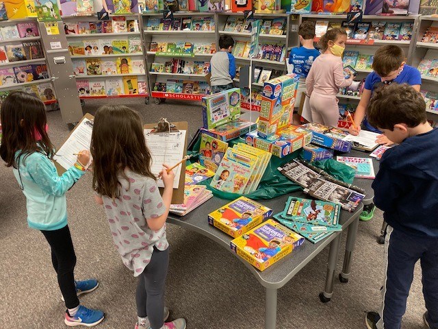 Students choosing books at the Book Fair