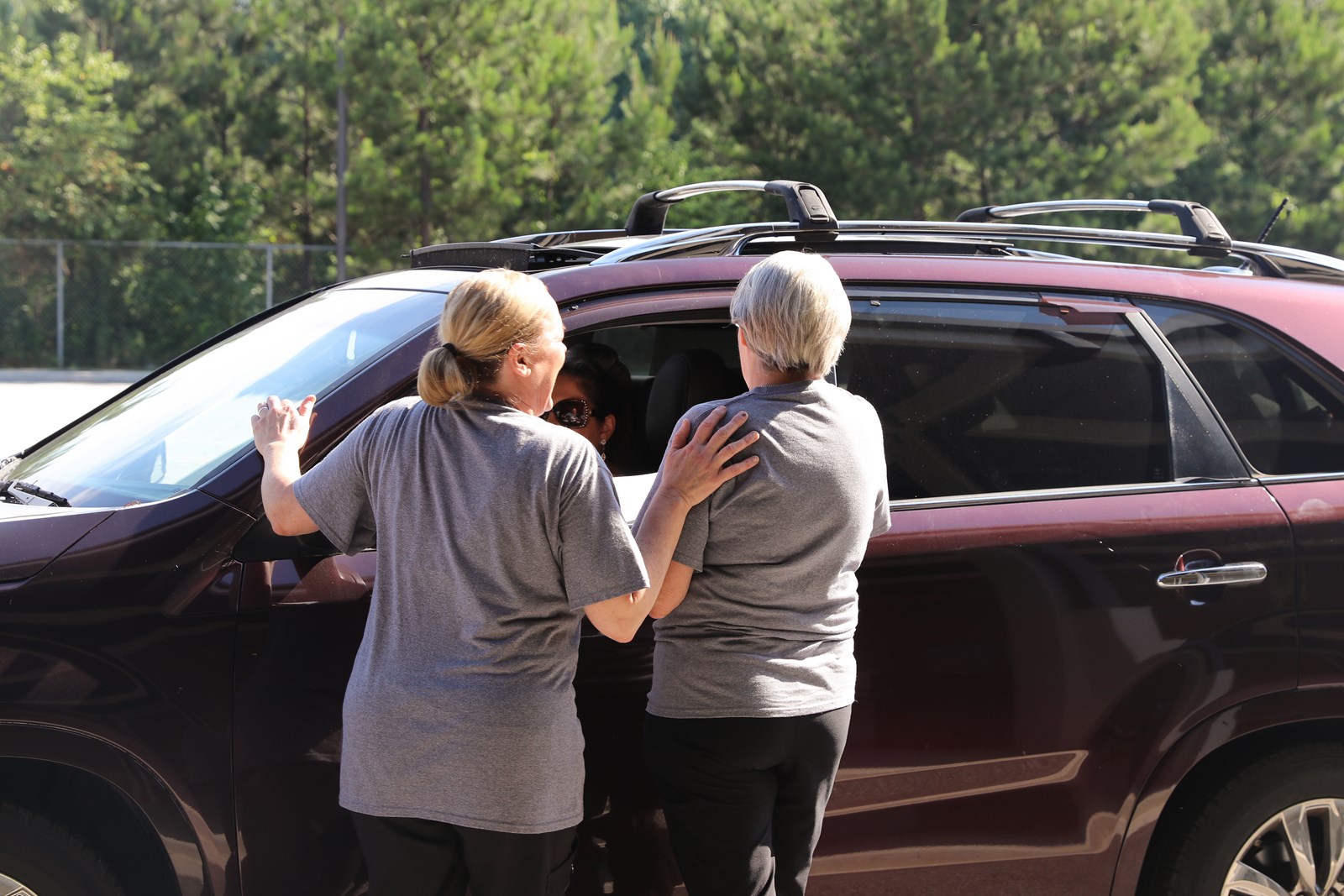 Cobb staff members build relationships with families picking up meal kits at Clarkdale Elementary School-7.jpg