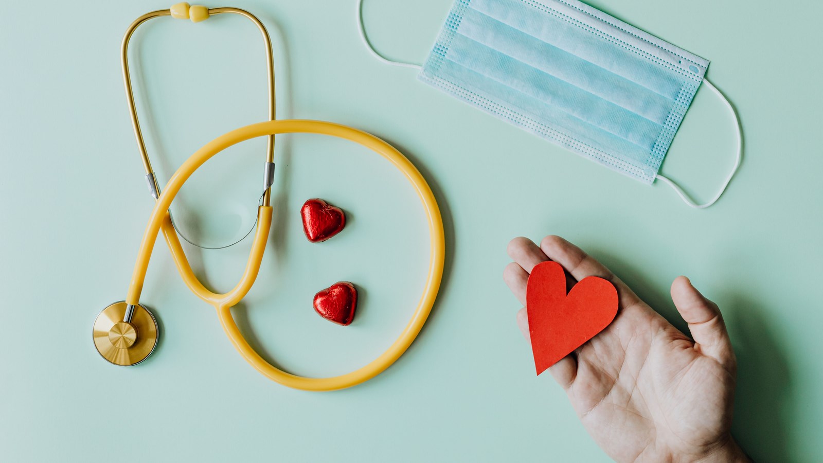 stethoscope mask hearts on light blue background