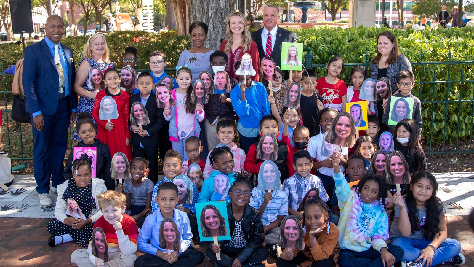 Argyle Elementary School students and community members join Jenifer Mitacek when she unveils her handprints on Marietta Square as the Cobb Schools Teacher of the Year.