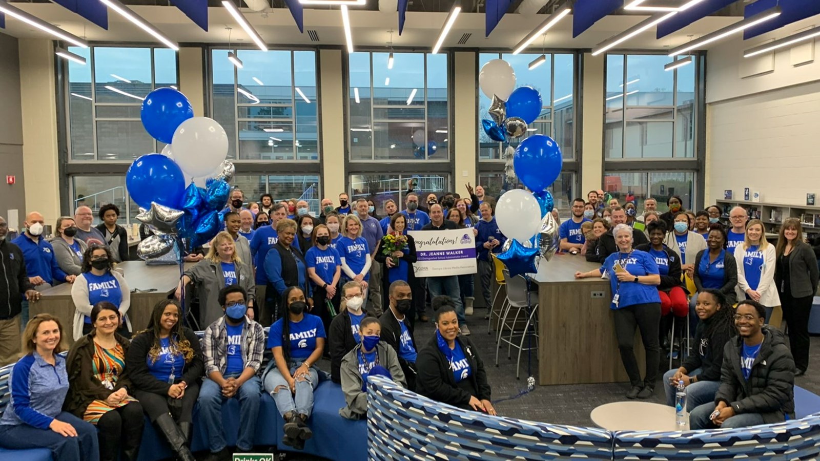 Campbell High School staff congratulate Dr. Jeanne Walker on being named the 2022 Distinguished Administrator Award