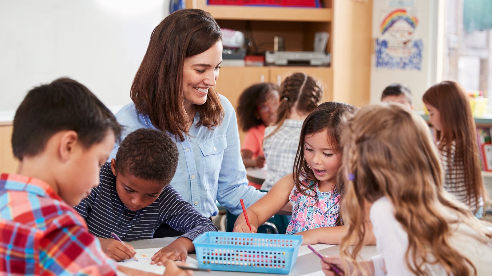 a teacher works with students