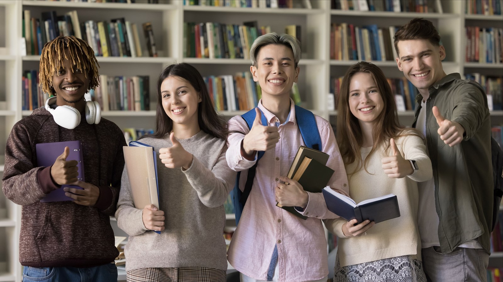 students give a thumbs up for great news.