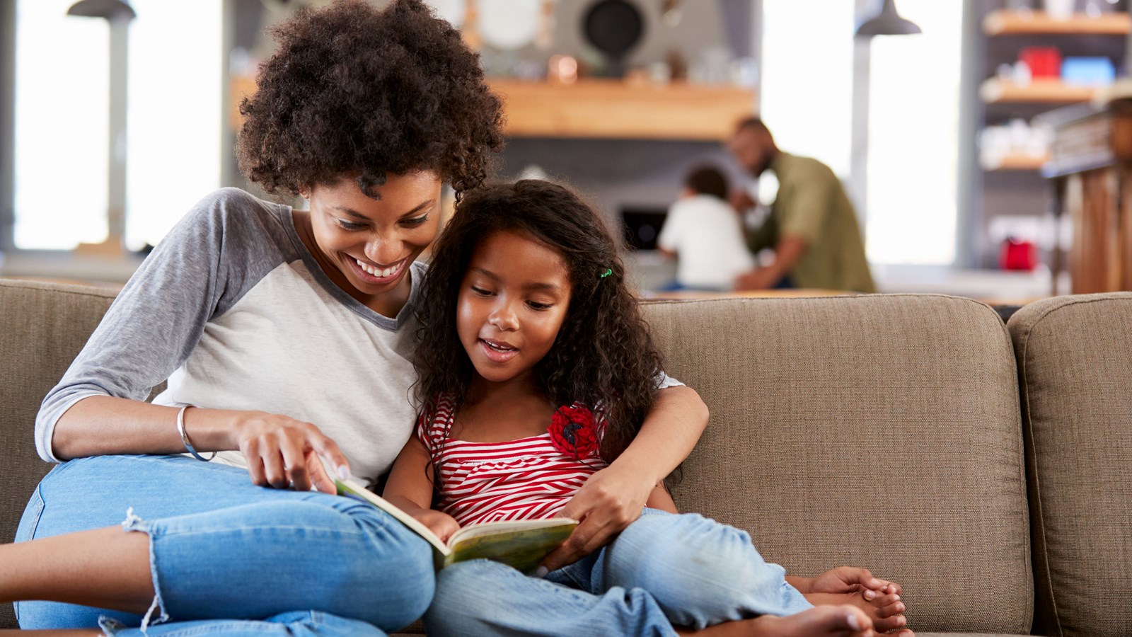A mom reads with her daughter