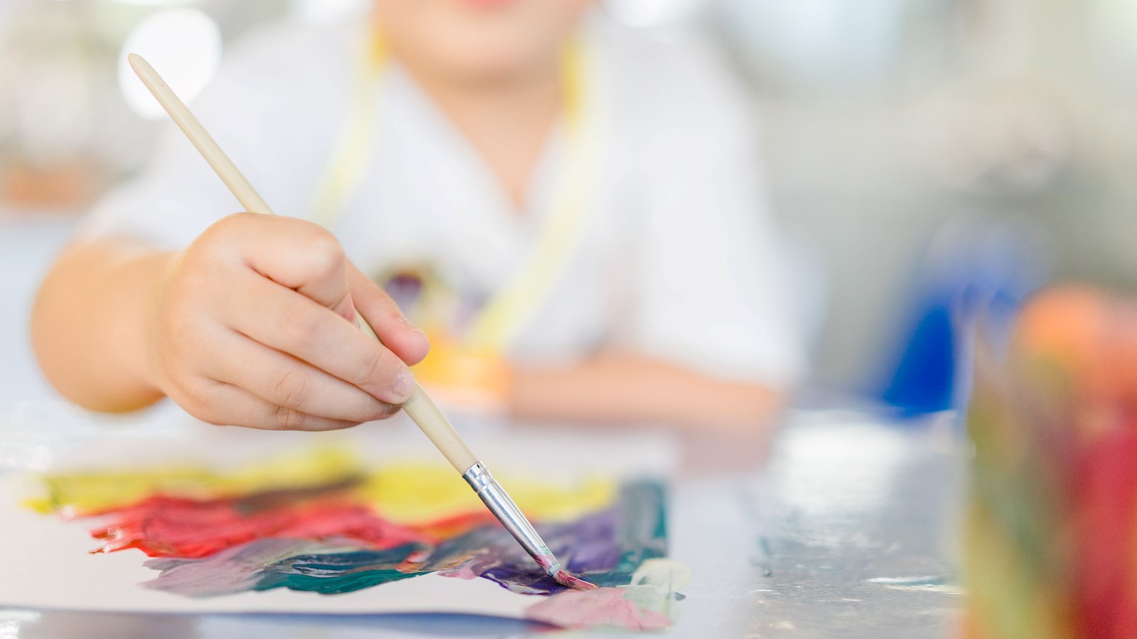 a student participates in art class